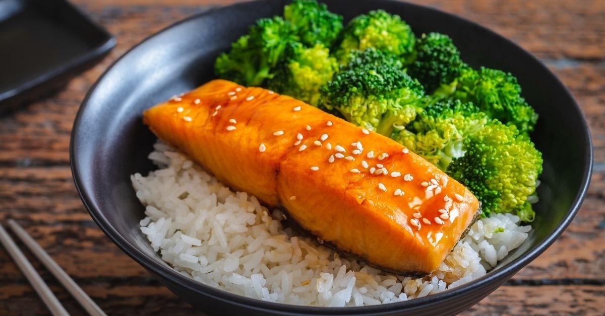 Homemade Teriyaki Salmon with Broccoli, Rice and Sesame Seeds in a Black Bowl