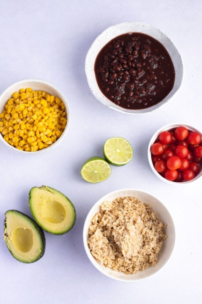 Mexican Buddha Bowl Ingredients: Brown Rice, Black Beans, Corn, Cherry, Tomatoes and Avocados