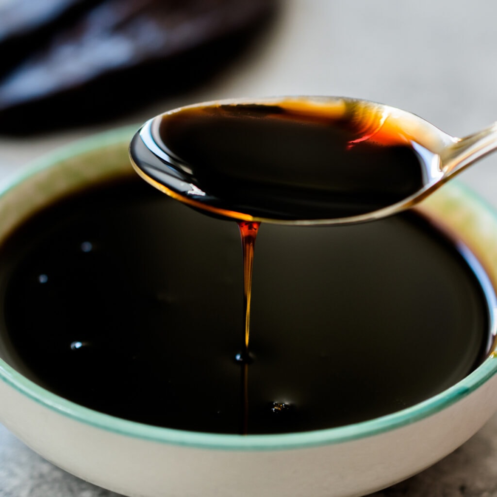 Molasses Dripping From Spoon Perfect as Sugar Substitute for Baking
