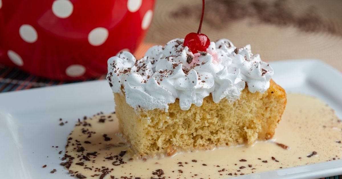 Sweet Homemade Tres Leches Cake with Chocolate and Cherry