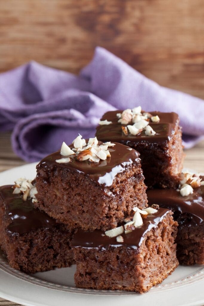 Sweet Keto Chocolate Squares With Chocolate Glaze and Chopped Nuts