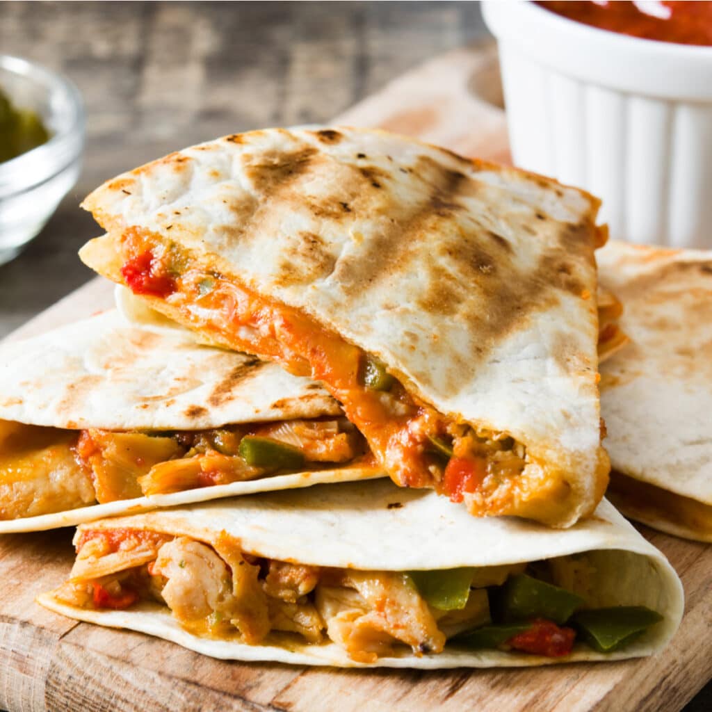 Sliced Taco Bell Quesadillas Served on a Wooden Chopping Board