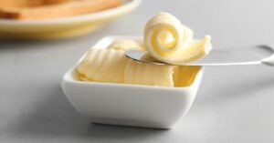 Tasty Butter Curls in a White Bowl