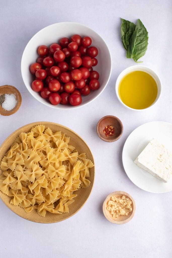 Tiktok Feta Pasta Ingredients: Feta, Cherry, Tomatoes, Garlic, Basil, Red Pepper Flakes, Olive Oil, salt, Pepper and Pasta