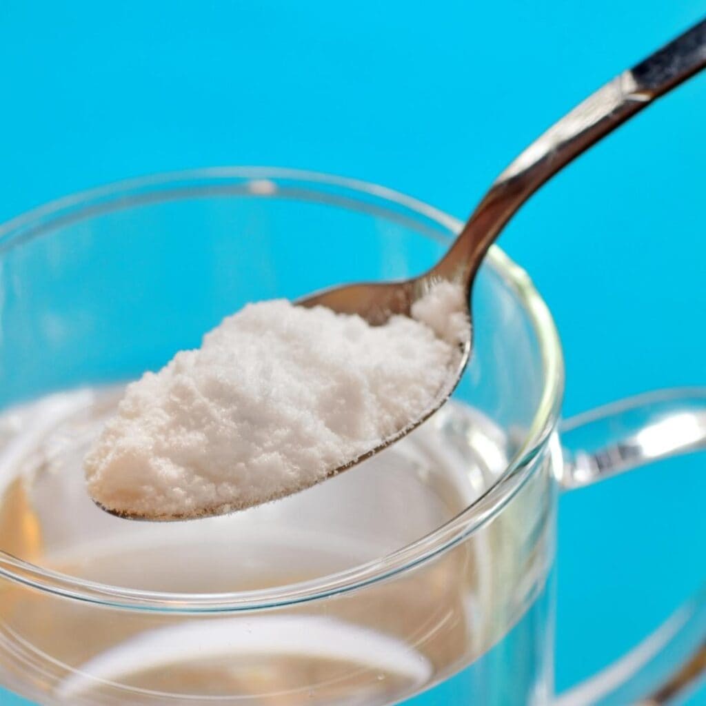 Spoon of Granulated Sugar and Water