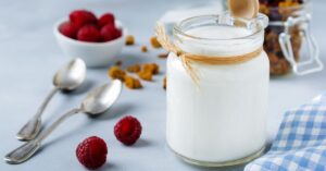 A Jar of Sour Milk with Raspberries