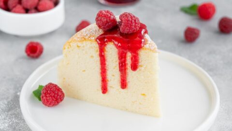 A Slice of Sweet Homemade Japanese Cotton Cheesecake with Raspberry and Sauce