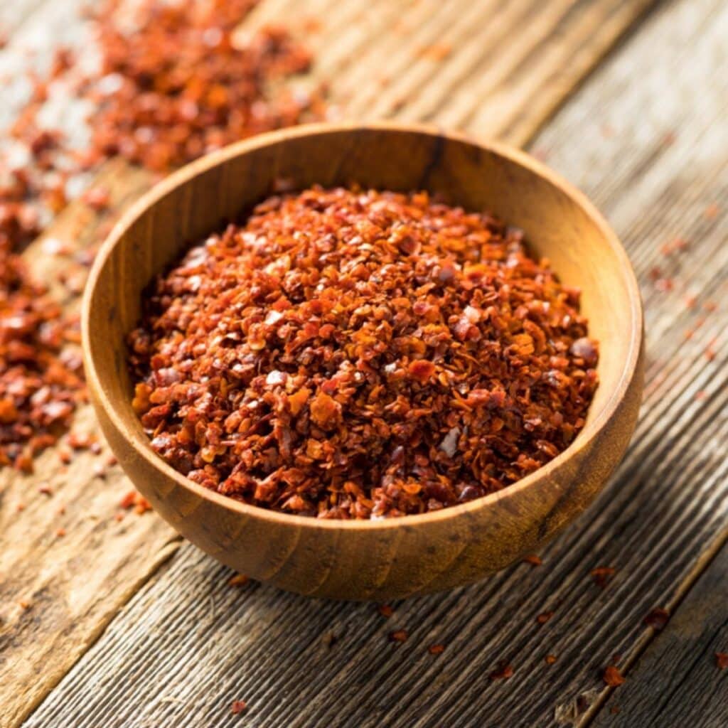 Aleppo Pepper On A Wooden Bowl