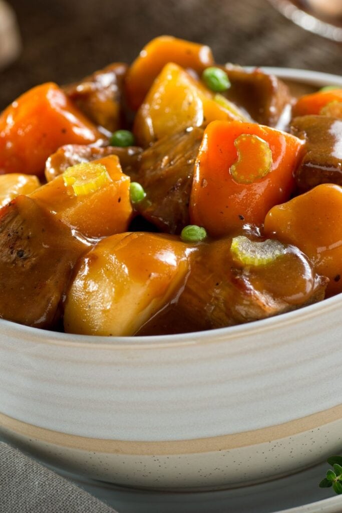 25 Best Steak Casserole Recipes! Shown in picture: Bowl of Hearty Beef Stew with Potatoes and Carrots