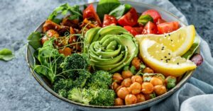 Buddha Bowl Salad with Chickpeas, Lemon, Broccoli, Tomatoes and Avocado