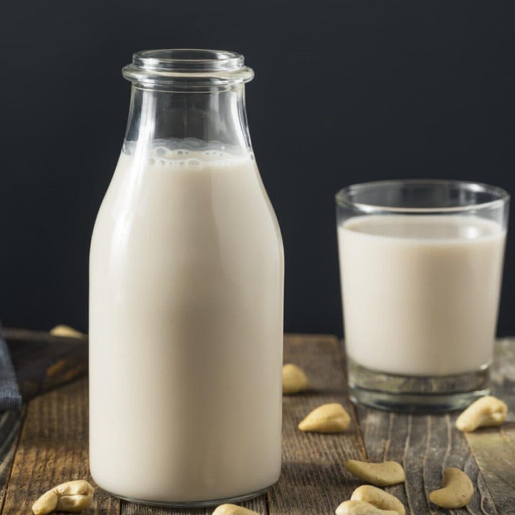 Cashew Milk in a Bottle and Glass