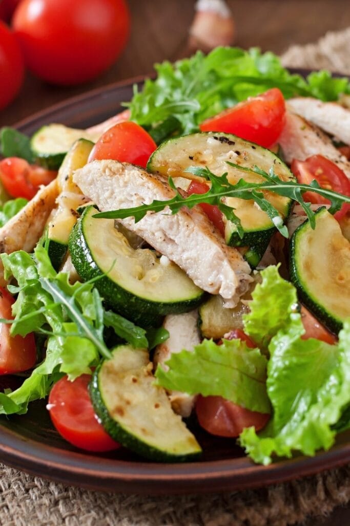These recipes prove that chicken and zucchini are a match made in heaven! Chicken and Vegetable Salad with Zucchini and Tomatoes shown in picture.