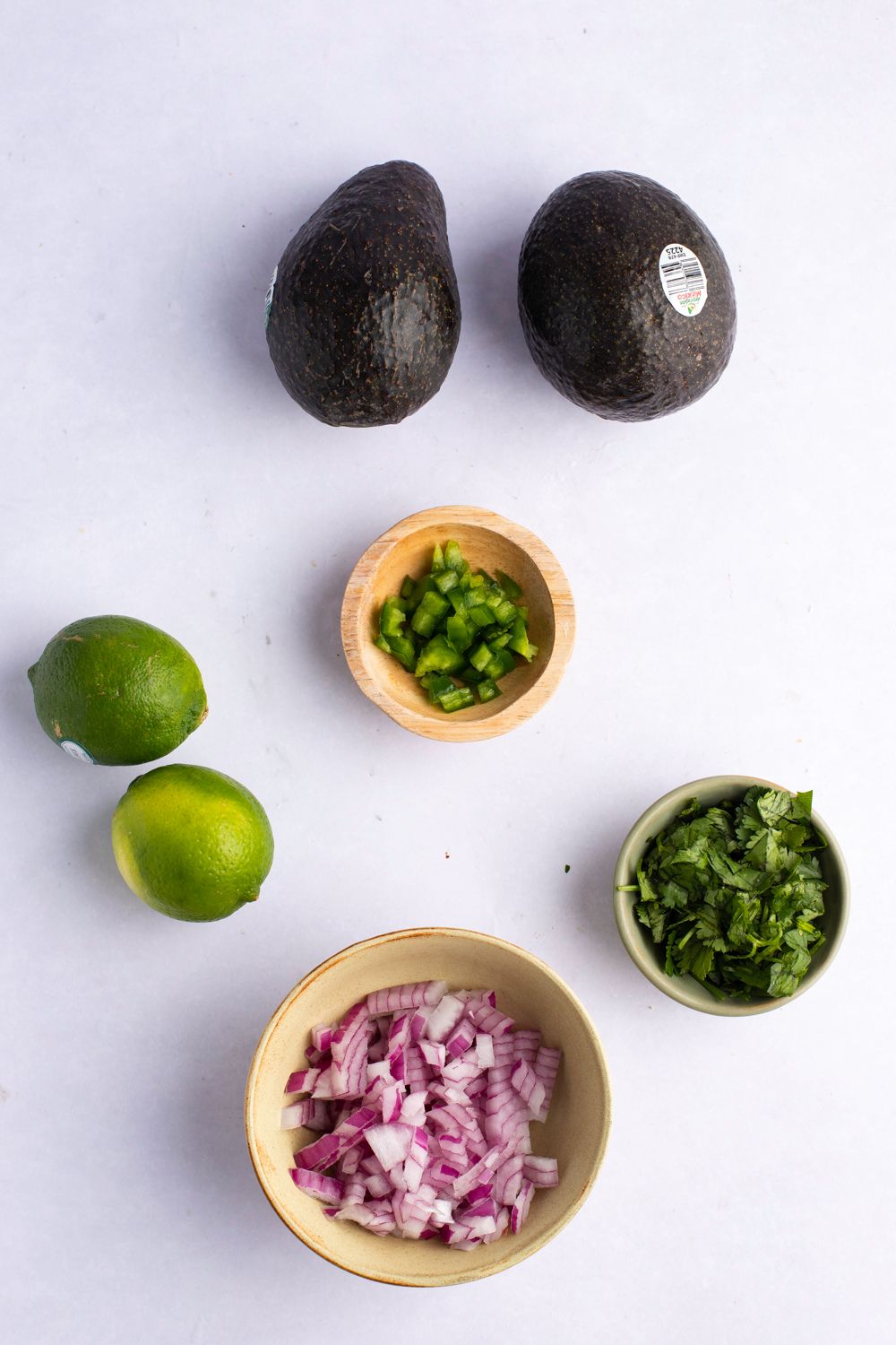 Chipotle Guacamole Ingredients- Avocados, Lime Juice, Cilantro, Onions, Jalapeno and Salt