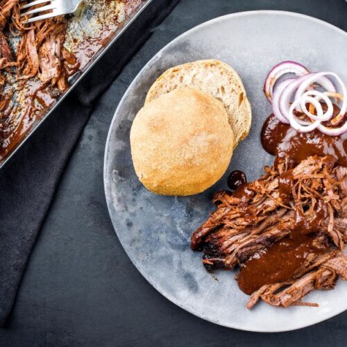 https://insanelygoodrecipes.com/wp-content/uploads/2022/06/Comforting-Homemade-Pulled-Pork-with-Bread-Onions-and-Sauce-500x500.jpg