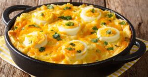 Egg Casserole From Boiled Potatoes and Eggs with Leek Cheese Sauce