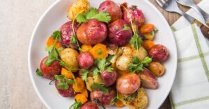 Healthy Yellow and Purple Potatoes in a Plate