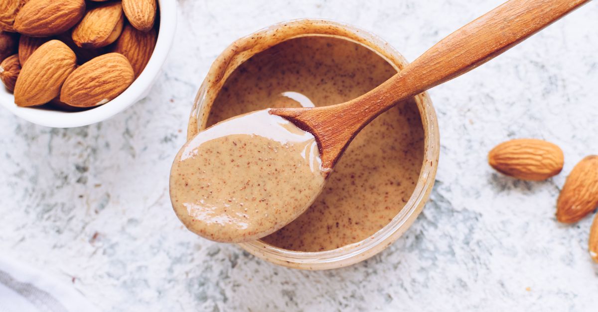 https://insanelygoodrecipes.com/wp-content/uploads/2022/06/Homemade-Almond-Butter-with-Almond-Nuts.jpg