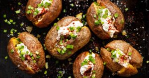 Homemade Baked Stuffed Potatoes with Cream Cheese, Butter and Green Onions