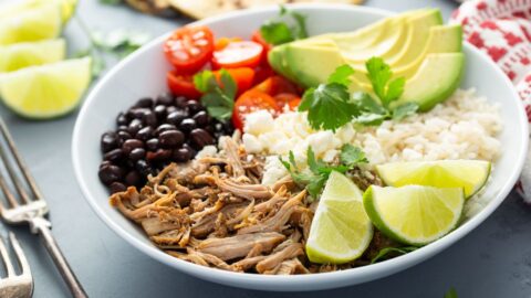 Homemade Burrito Bowl with Pork Carnitas, Black Beans, Lime, Avocados and Tomatoes
