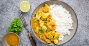 Homemade Spicy Chicken Curry with Rice, Herbs and Lime