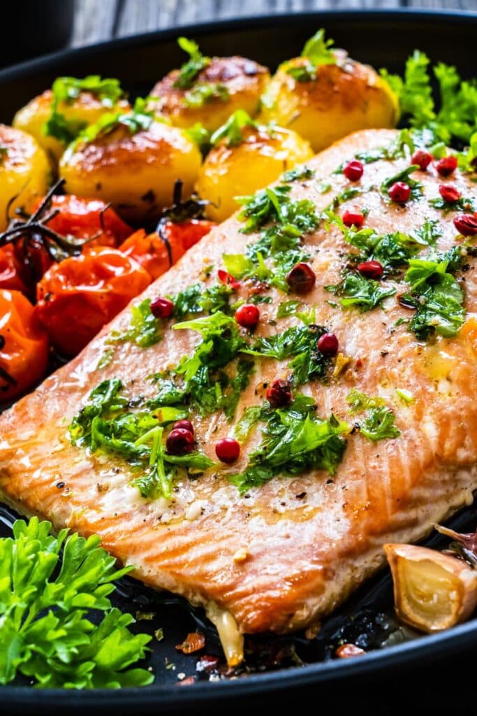 30 Keto Salmon Recipes (Delicious, Healthy, & Easy Dinners). Keto salmon steak with potatoes and vegetables shown in picture.