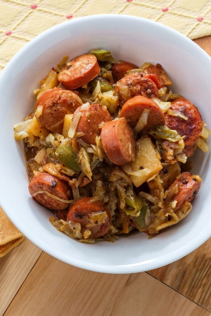 30 Easy Kielbasa Recipes That are Real Wieners! Kielbasa shown in photo with Potatoes, Onions and Coleslaw.