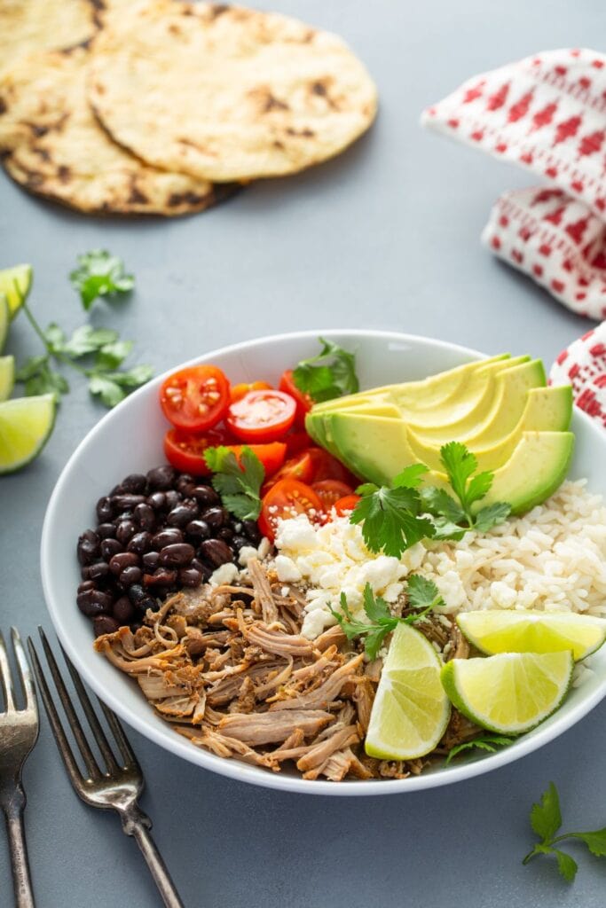 Mexican Pork Carnitas with Lime, Avocado, Beans and Tomatoes