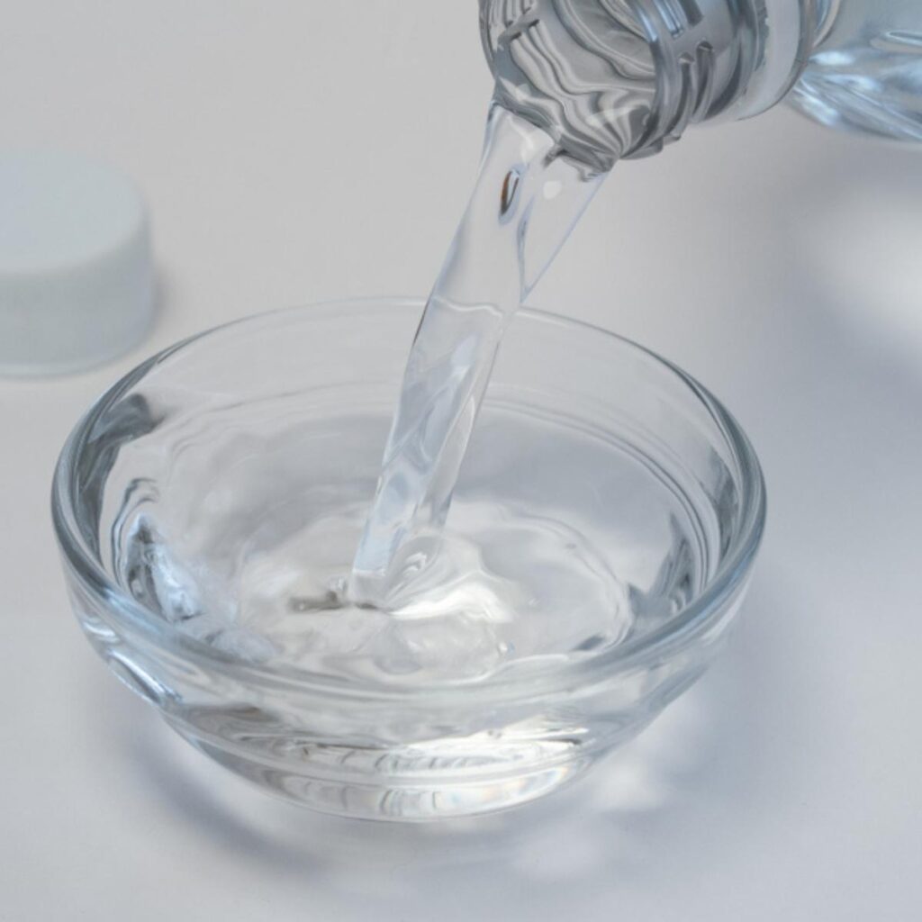 White Vinegar Poured on a Small Glass Dish