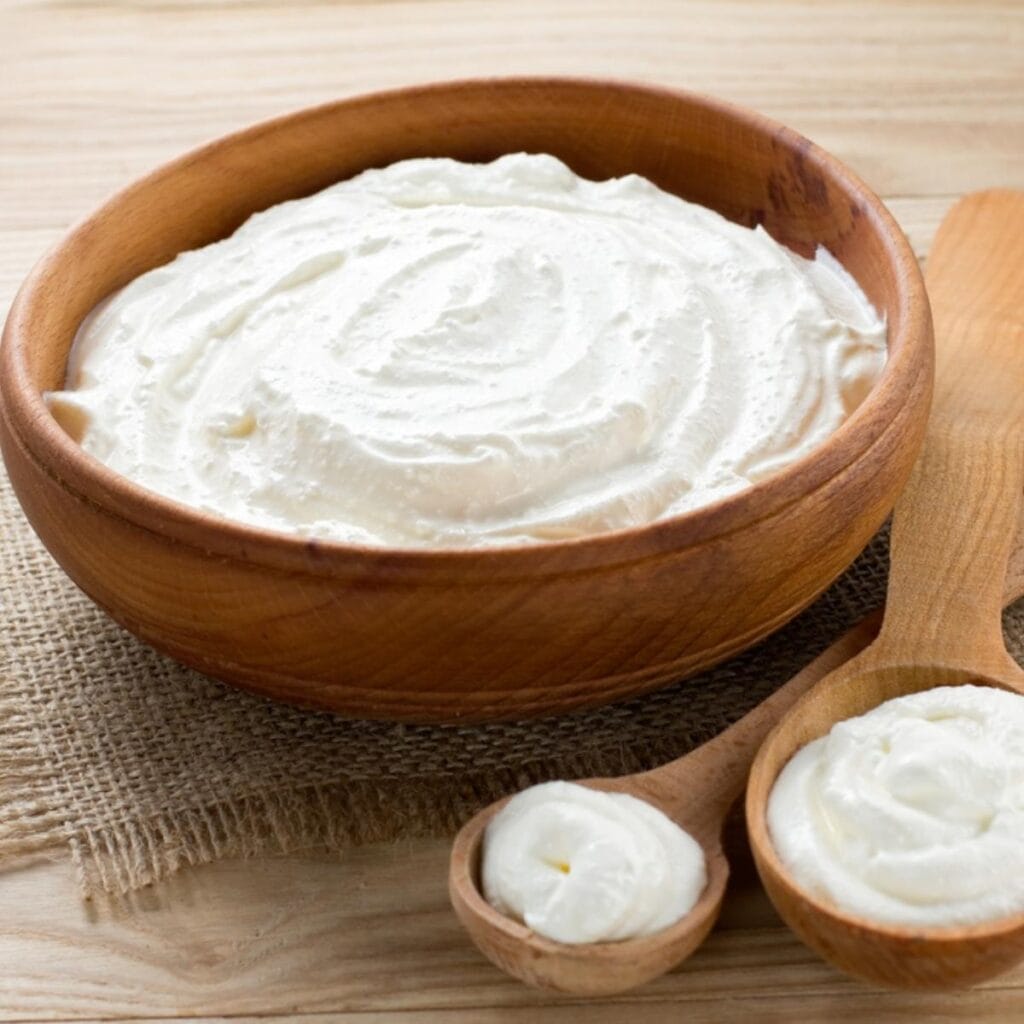 Sour Cream in a Wooden Bowl
