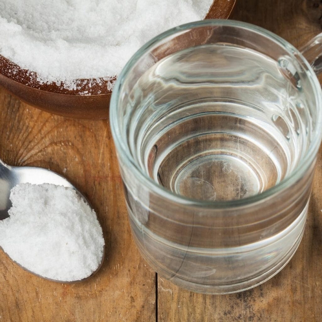 Sugar and Water on a Wooden Table