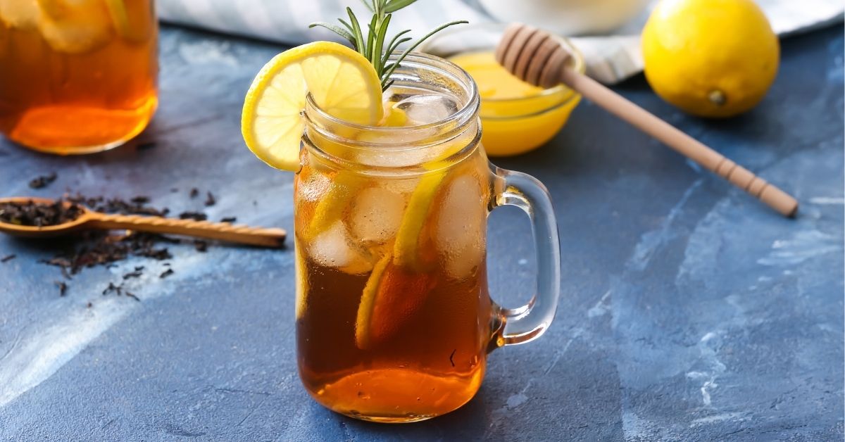 Sweet Sun Tea with Lemon and Ice in a Mason Jar
