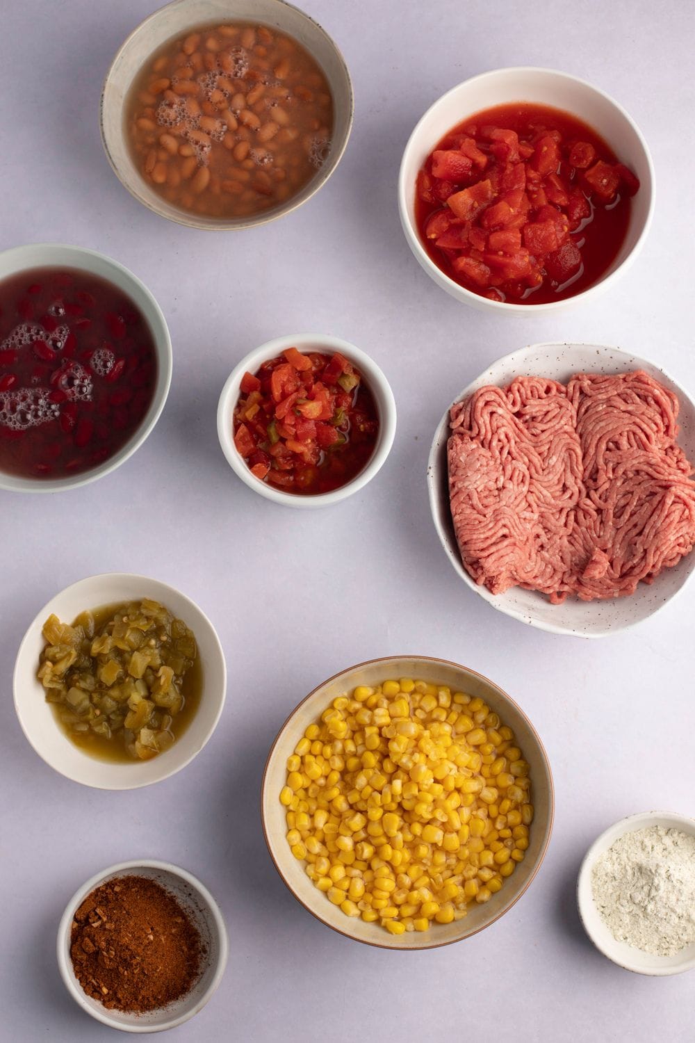 Taco Soup Ingredients - Beans, Canned Corn, Canned Tomatoes and Chilies, Taco Seasoning, Ranch Dressing, and Ground Beef