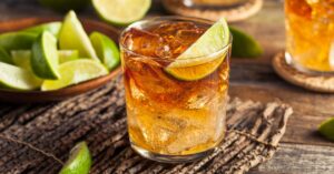 A Glass of Cold Boozy Stormy Cocktail with Lime