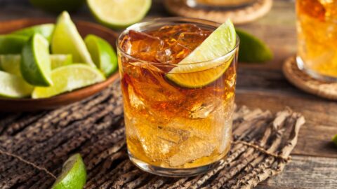 A Glass of Cold Boozy Stormy Cocktail with Lime