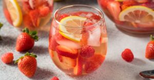 A Glass of Homemade Rose Wine Sangria with Strawberries and Lemons