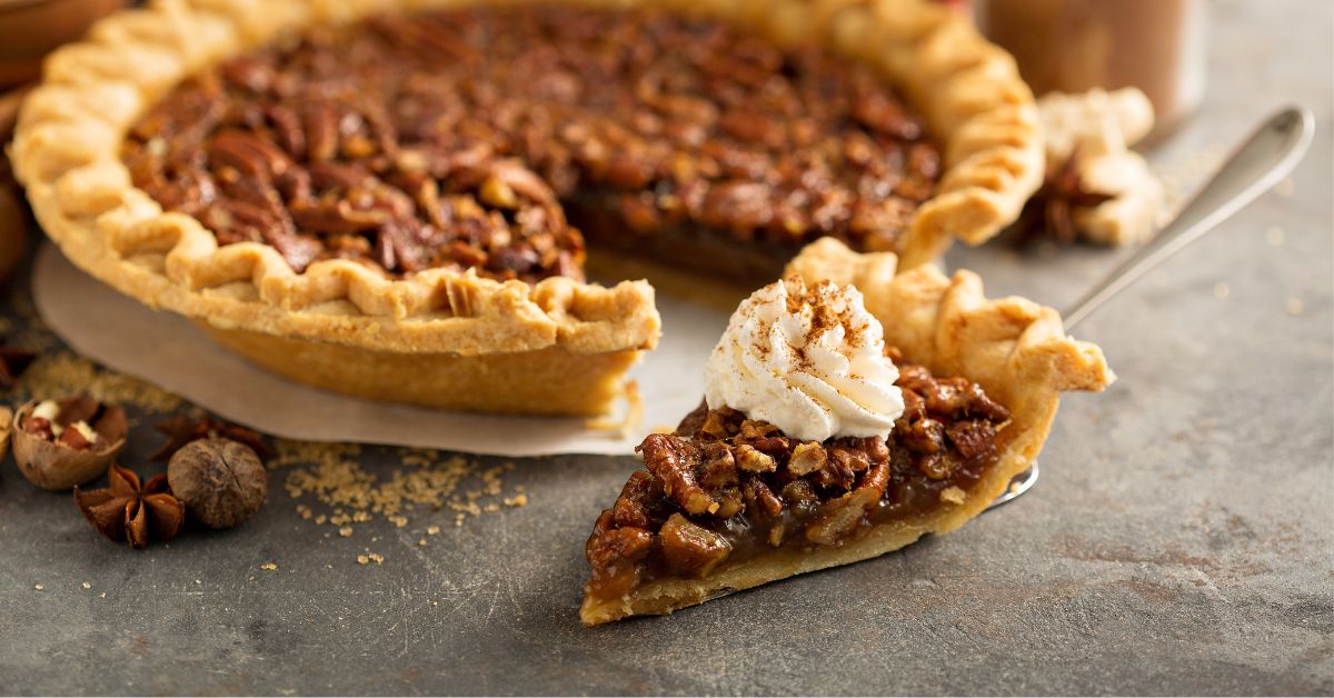 A Slice of Pecan Pie with Cinnamon and Whipped Cream