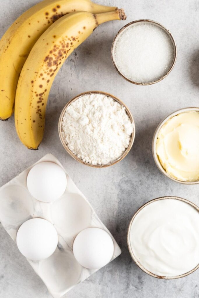Banana Bread Ingredients: butter, bananas, sugar, eggs, vanilla, flour, baking soda, and spices