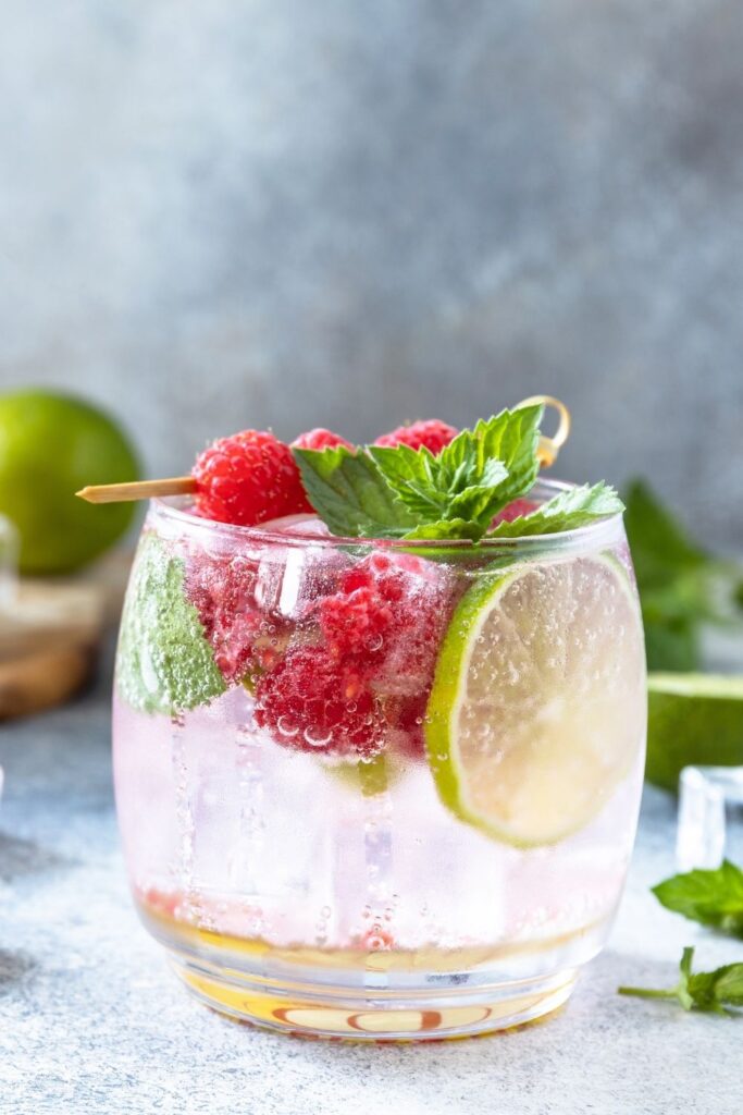 Boozy White Claw Hard Seltzer Cocktail with Raspberries and Lime