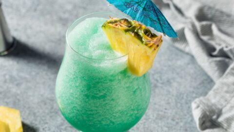 Boozy and Refreshing Blue Hawaiian Cocktail with Pineapple and Rum
