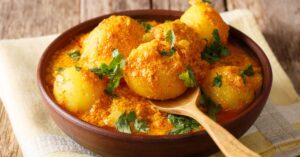 Bowl of Homemade Indian Spicy Potatoes with Herbs