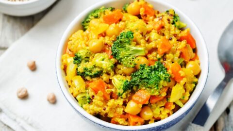 Bowl of Homemade Quinoa Curry with Carrots and Broccoli