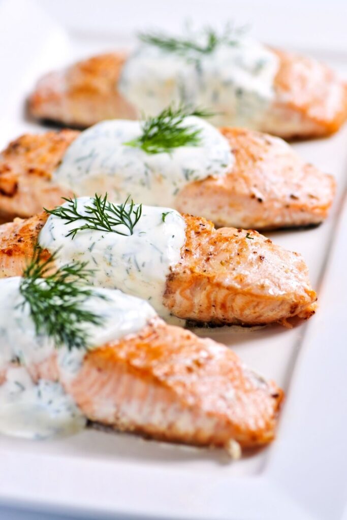 Cooked Salmon with Dill Sauce on top