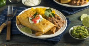 Homemade Beef Chimichanga with Beans, Rice and Tomatoes
