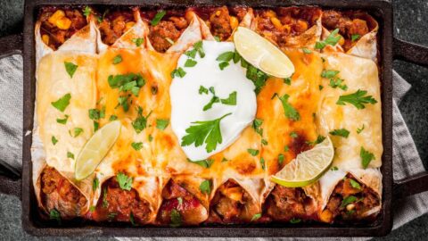 Homemade Beef Enchiladas with Whipped Cream and Lime