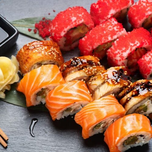 https://insanelygoodrecipes.com/wp-content/uploads/2022/07/Homemade-Sushi-Rolls-with-Vegetables-and-Salmon-500x500.jpg