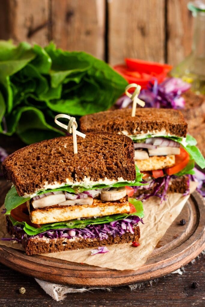 25 Vegan Sandwiches For a Hearty and Healthy Lunch. Shown in picture: Homemade Vegan Sandwich with Tofu and Vegetables