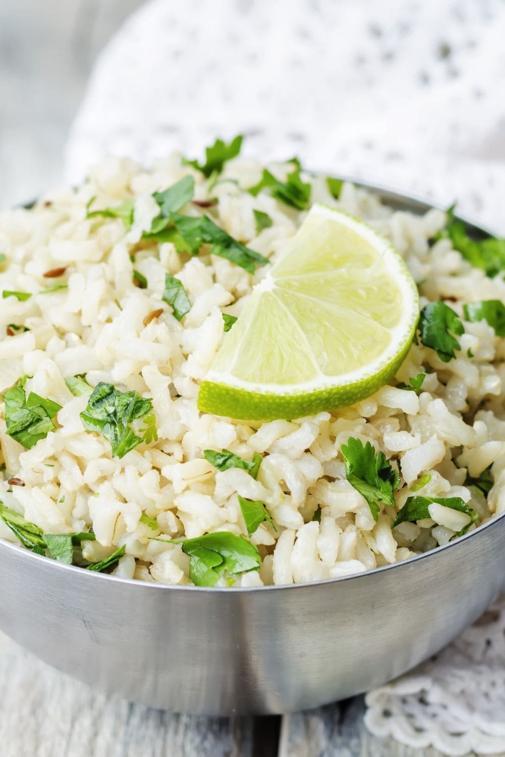Rice with lime in a bowl with herbs