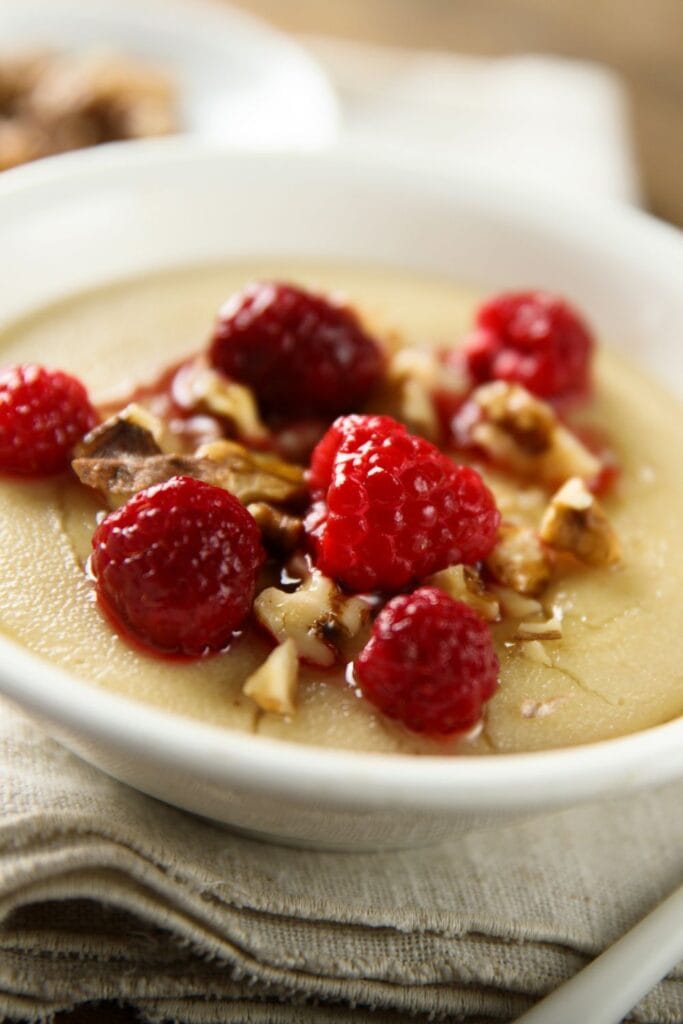 17 Easy Semolina Recipes Everyone Will Love. Shown in picture is Semolina Pudding with Raspberries and Nuts