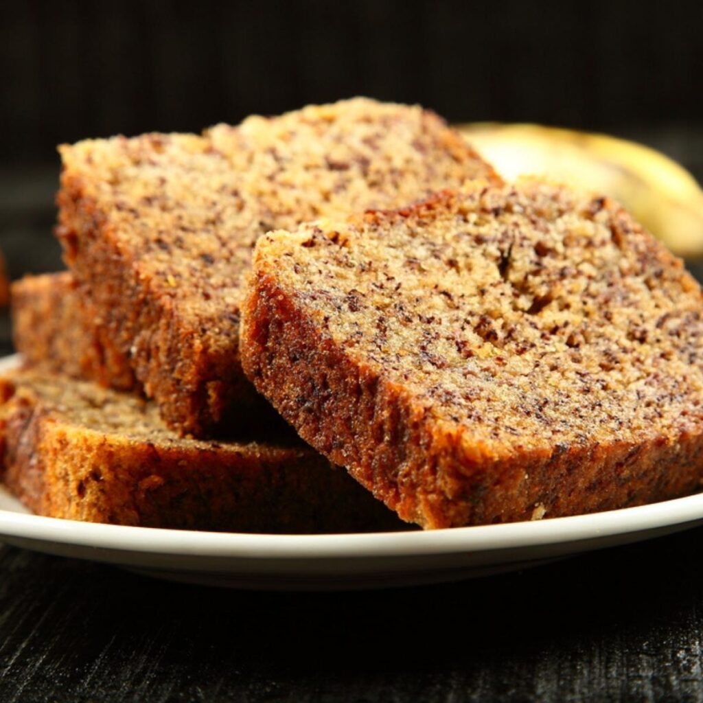 Sliced Brown Butter Banana Bread on a White Plate