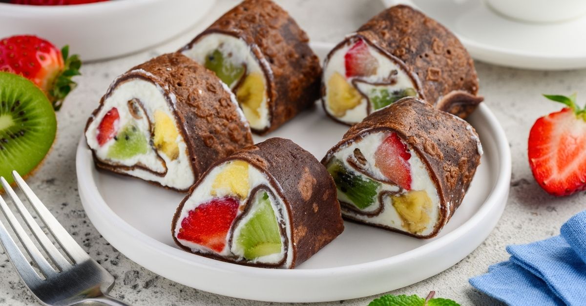 Sweet Homemade Sushi Dessert with Chocolate Crepes, Fruits and Ricotta